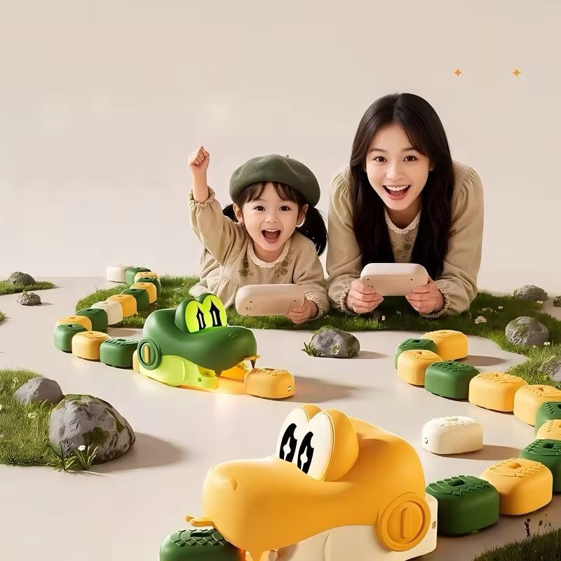 Parent and child on the floor, each driving a snake
