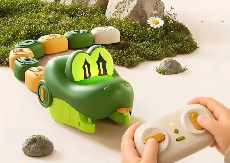 Two hands on the remote, green snake heading for the beans