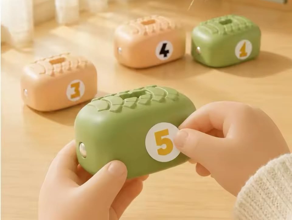 A number sticker being pressed onto a green bean
